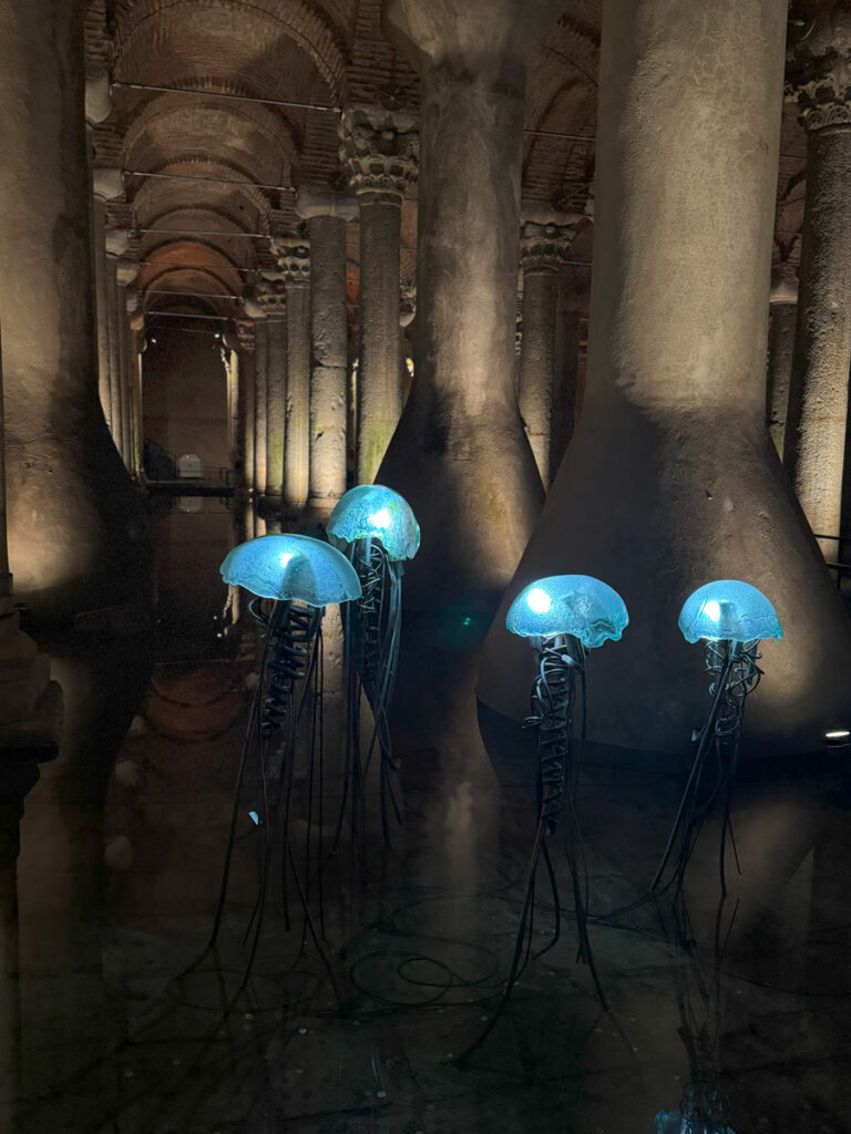 Illuminated jellyfish-like art installation in the side aisle exhibition area of the Basilica Cistern, Istanbul.