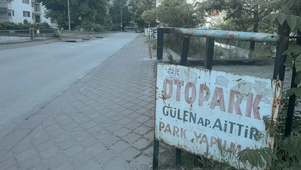 Old rusted parking sign on a quiet Ankara residential street