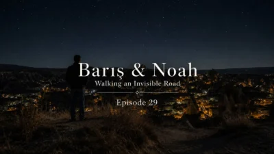 Barış overlooking the illuminated valleys of Cappadocia at night