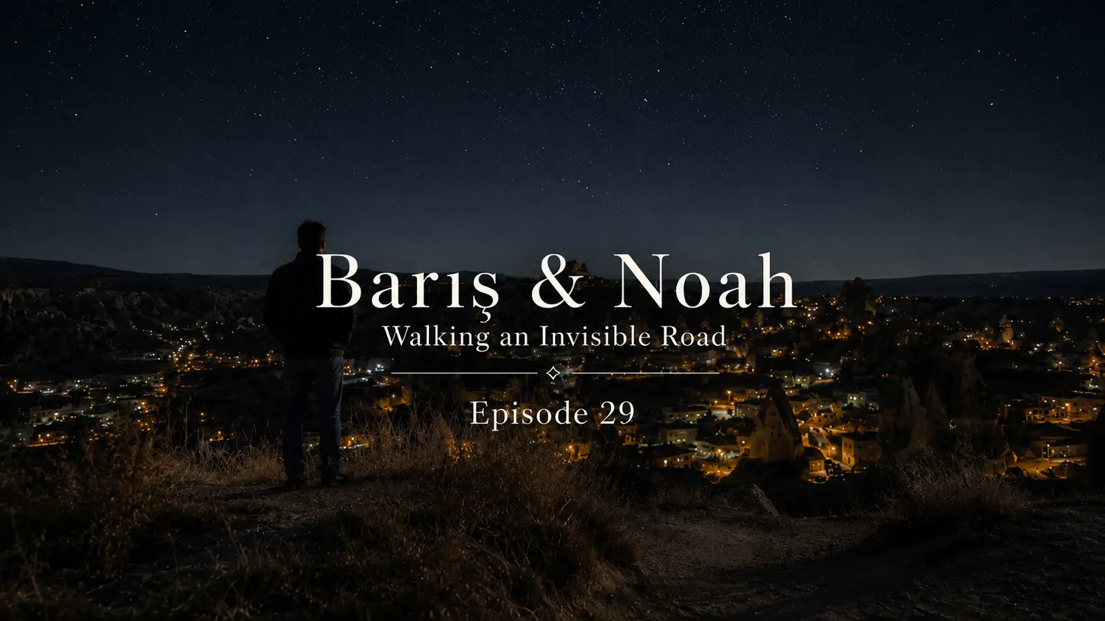 Barış overlooking the illuminated valleys of Cappadocia at night
