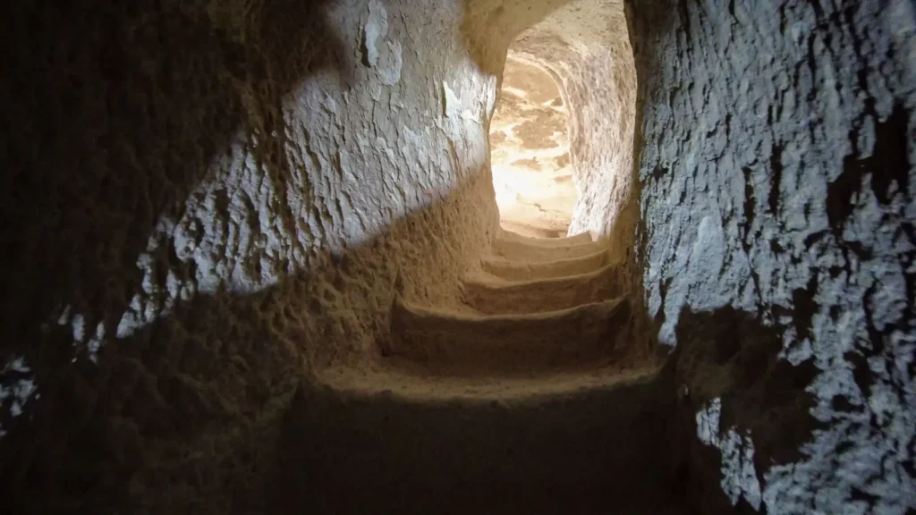 Stone passage leading toward light in Cappadocia