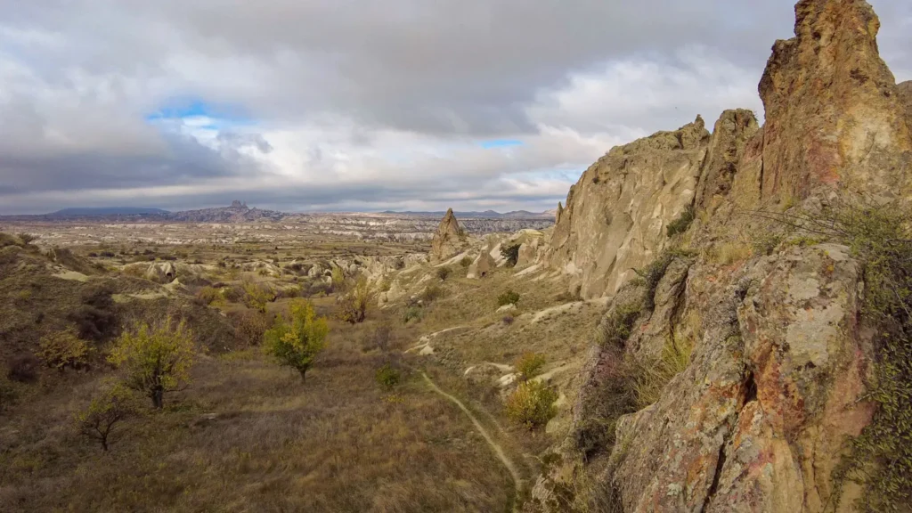 Rocky valley path in Cappadocia under a dramatic sky