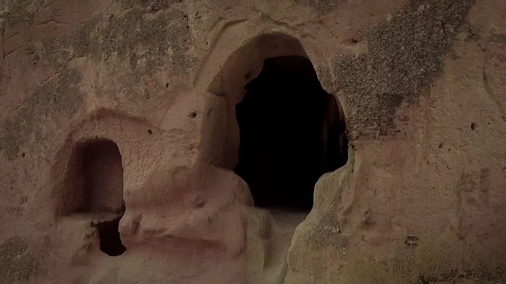 Ancient cave entrance carved into rock in Göreme, Cappadocia