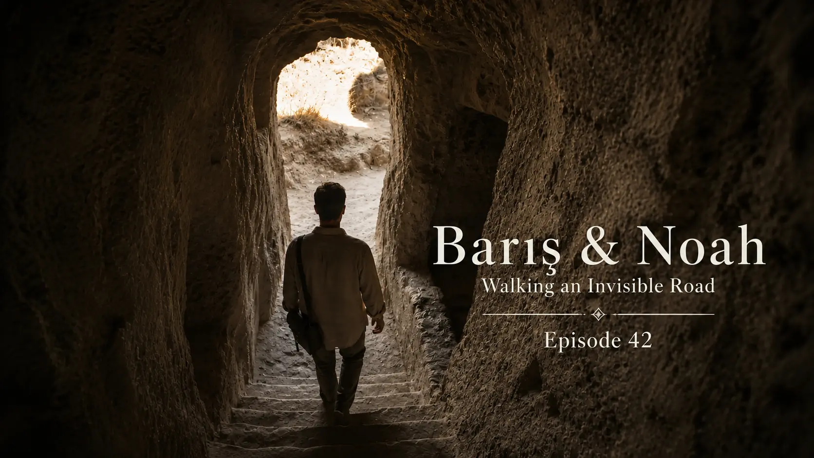 Barış walks toward the light at the exit of Derinkuyu Underground City in Cappadocia.
