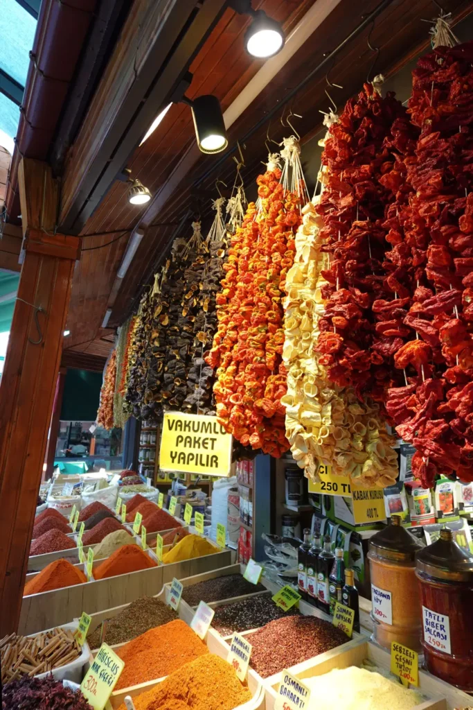 Dried vegetables and colorful spices displayed at a shop in Ulus Hali