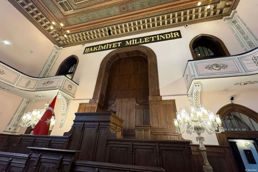 Historic parliamentary rostrum beneath the Hâkimiyet Milletindir inscription inside Ankara Republic Museum, Türkiye.